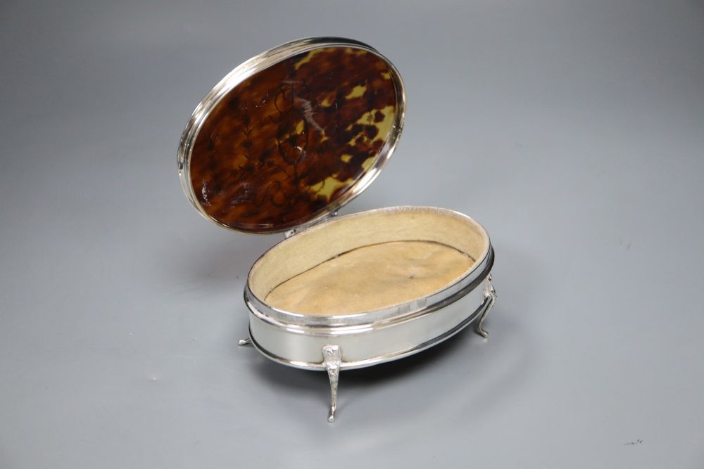 A George V silver and tortoiseshell oval trinket box, Birmingham, 1919, 14.5cm.